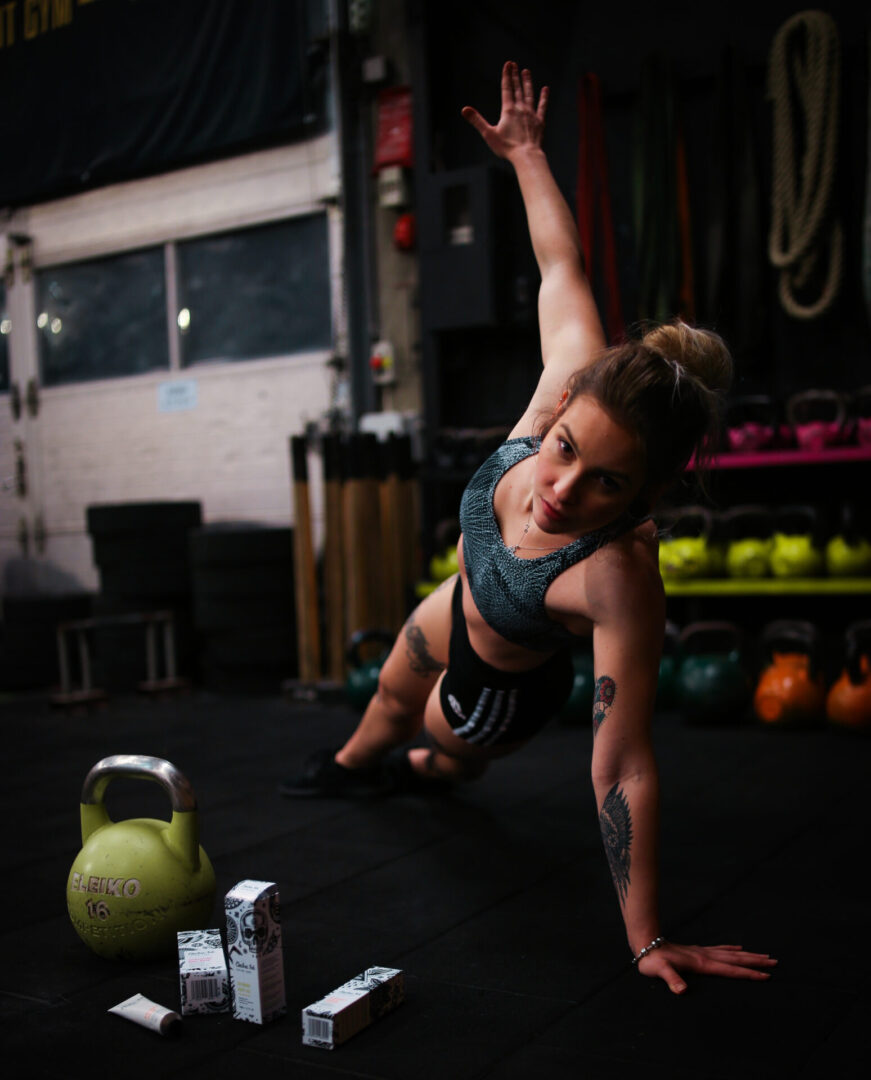 A woman is doing an exercise on the floor